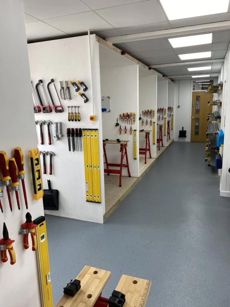 Individual bays and neatly arranged hand tools on the walls in worecester centre