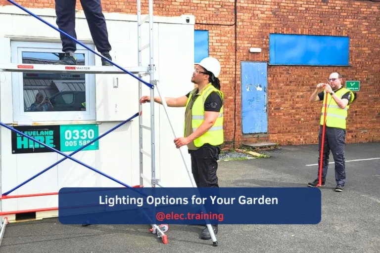 Trainee practising conduit fitting and lighting setup on scaffold