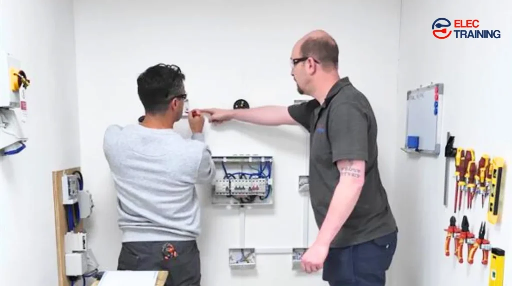 Adult learner receiving hands-on electrical training under instructor supervision in a practical workshop.