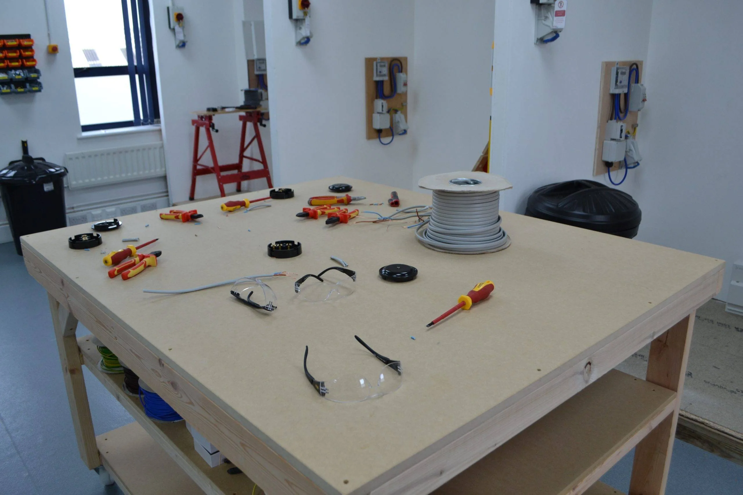 Electrical tools displayed on the training bench