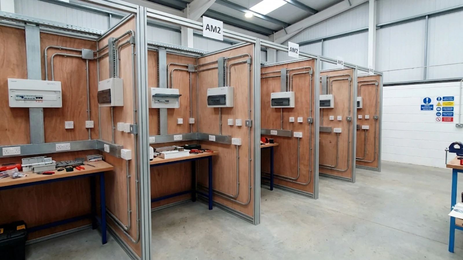 AM2 assessment workshop environment showing professional test bays and workstations